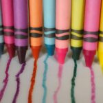 a group of crayons lined up in a row